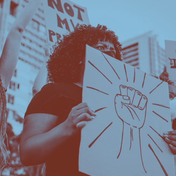 Protesters holding signs