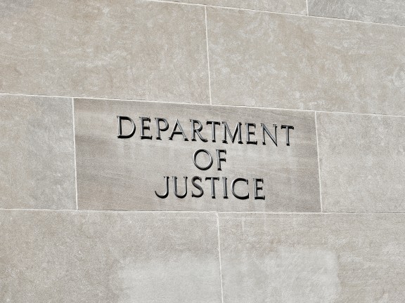 Department of Justice sign on Building Wall