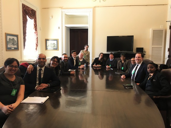People around a large desk at LGBT Criminal Justice Federal Working Group Meeting with DPC at White House April 2016