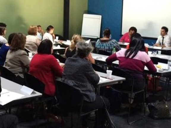 People at desks attending New Jersey Convening