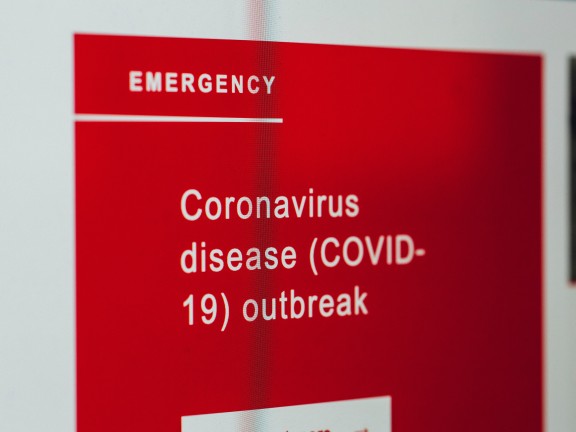 sign reading emergency: covid outbreak