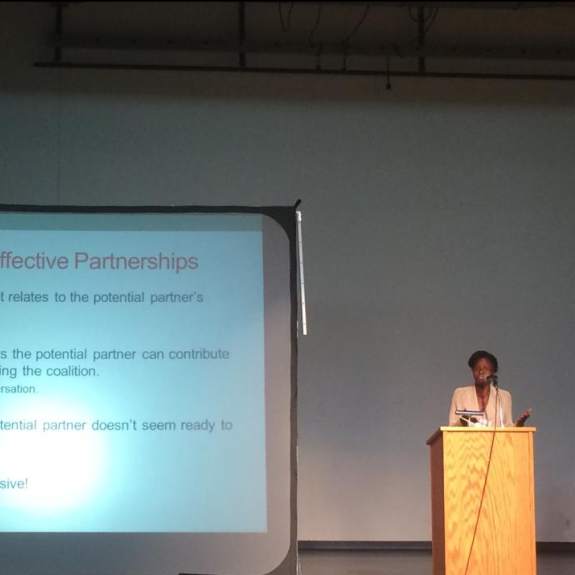 Rashida Richardson speaks at HINAC podium