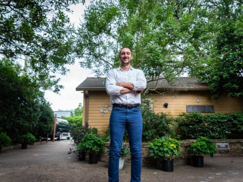 Ian Bicko, executive director of Project Lazarus, poses for a photo on the grounds of the home in New Orleans. Project Lazarus is one of the few remaining housing programs dedicated to people living with HIV. Credit: Halle Parker / Verite News