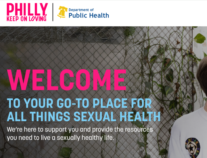 Screenshot of phillykeeponloving.com with a photo of two men smiling with pink and blue logos and letters welcoming to your go-to place for all things sexual health.
