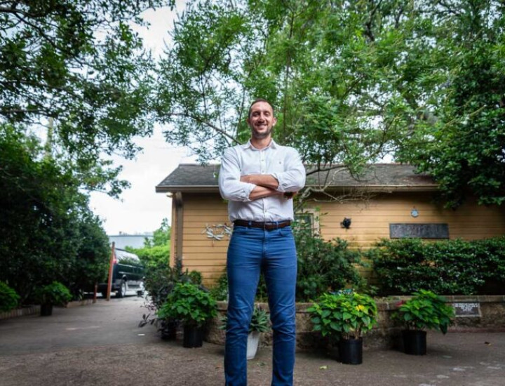 Ian Bicko, executive director of Project Lazarus, poses for a photo on the grounds of the home in New Orleans. Project Lazarus is one of the few remaining housing programs dedicated to people living with HIV. Credit: Halle Parker / Verite News