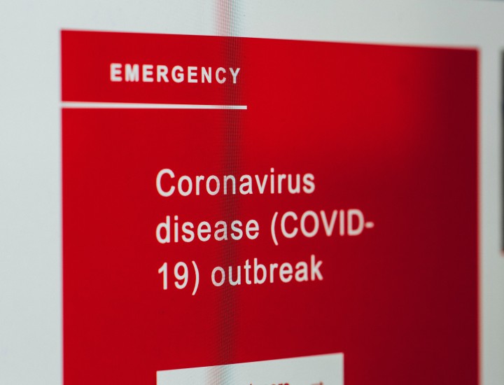 sign reading emergency: covid outbreak